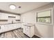 Charming kitchen with white cabinets, granite countertops, and stainless sink at 62 Sunny Ln, Villa Rica, GA 30180