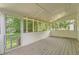 Relaxing screened porch offers view of the backyard and surrounding greenery at 62 Sunny Ln, Villa Rica, GA 30180