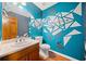 Unique bathroom featuring artistic wall decor and a single sink vanity at 1237 Hunters Dr, Stone Mountain, GA 30083