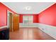 Spacious bedroom with hardwood floors, large window, and crown molding at 1237 Hunters Dr, Stone Mountain, GA 30083