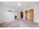 Spacious bedroom featuring plush carpet, large closet, and neutral paint, ready for personalization at 1237 Hunters Dr, Stone Mountain, GA 30083