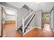 Foyer with hardwood floors, staircase, and view into multiple rooms at 1237 Hunters Dr, Stone Mountain, GA 30083