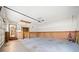 Large garage featuring wood paneled walls and plenty of space for storage and two vehicles at 1237 Hunters Dr, Stone Mountain, GA 30083
