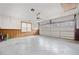 A spacious garage with a window accent above the large garage door at 1237 Hunters Dr, Stone Mountain, GA 30083