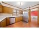 Kitchen with stainless steel refrigerator and wood cabinetry at 1237 Hunters Dr, Stone Mountain, GA 30083