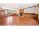 Spacious living room featuring hardwood floors and a brick fireplace at 1237 Hunters Dr, Stone Mountain, GA 30083