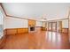 Spacious living room features a brick fireplace and access to the outdoor patio at 1237 Hunters Dr, Stone Mountain, GA 30083