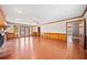 Open-concept living room with hardwood floors, fireplace, and natural light at 1237 Hunters Dr, Stone Mountain, GA 30083