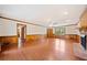 Large living room with hardwood flooring, natural light, and access to other rooms at 1237 Hunters Dr, Stone Mountain, GA 30083
