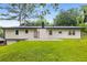 Charming one-story home with lush green lawn and patio in the backyard at 3536 Redwine Ct, Atlanta, GA 30344