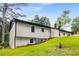 Charming one-story home with lush green lawn and landscaping in the backyard at 3536 Redwine Ct, Atlanta, GA 30344