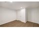 Unfurnished basement space with wood-look flooring, white walls, and a simple closet at 3536 Redwine Ct, Atlanta, GA 30344