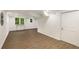 Spacious basement area with wood-look floors, featuring a storage closet and recessed lighting at 3536 Redwine Ct, Atlanta, GA 30344