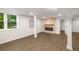 Basement area showcasing a modern fireplace, wood-look floors, and recessed lighting at 3536 Redwine Ct, Atlanta, GA 30344