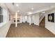 Open basement floor plan with a wood-look fireplace, recessed lighting, and easy access to stairs at 3536 Redwine Ct, Atlanta, GA 30344