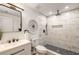 Contemporary bathroom featuring marble-tiled shower, modern fixtures, and stylish decorative details at 3536 Redwine Ct, Atlanta, GA 30344