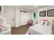 Bright bedroom featuring closet with sliding barn door, stylish decor, and a comfortable retreat at 3536 Redwine Ct, Atlanta, GA 30344