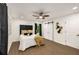 This bedroom features wood-look floors, a ceiling fan, and sliding doors leading to a closet at 3536 Redwine Ct, Atlanta, GA 30344