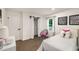 Bright bedroom featuring closet with sliding barn door, stylish decor, and a comfortable retreat at 3536 Redwine Ct, Atlanta, GA 30344
