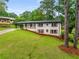 Charming home with a covered porch and well-manicured lawn, surrounded by mature trees at 3536 Redwine Ct, Atlanta, GA 30344