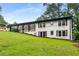 Charming home with a covered porch and well-manicured lawn, surrounded by mature trees at 3536 Redwine Ct, Atlanta, GA 30344
