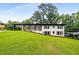 Charming home with a covered porch and well-manicured lawn, surrounded by mature trees at 3536 Redwine Ct, Atlanta, GA 30344