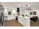 Open kitchen with a center island, stainless appliances, and clear sight lines to the living room at 3536 Redwine Ct, Atlanta, GA 30344