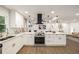 Bright kitchen with white cabinets, stainless steel appliances, and hardwood floors at 3536 Redwine Ct, Atlanta, GA 30344