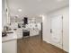 Modern kitchen with stainless appliances, white cabinets and hardwood floors at 3536 Redwine Ct, Atlanta, GA 30344