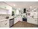 Modern kitchen featuring stainless steel appliances, white countertops and a black range hood at 3536 Redwine Ct, Atlanta, GA 30344