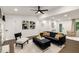 Inviting living space with modern art, sleek black furniture, and a neutral color palette at 3536 Redwine Ct, Atlanta, GA 30344