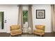 Comfortable chairs, complemented by a side table, and natural light at 3536 Redwine Ct, Atlanta, GA 30344