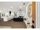 Open-concept living room featuring a modern kitchen, fireplace, and stylish decor at 3536 Redwine Ct, Atlanta, GA 30344