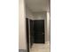 Hallway featuring dark doors and trim, with light walls and flooring at 870 Mayson Turner Nw Rd # 1102, Atlanta, GA 30314