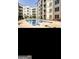 Exterior shot of complex pool, lined with many balconies at 870 Mayson Turner Nw Rd # 1102, Atlanta, GA 30314