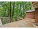 Spacious wooden deck overlooking a private, wooded backyard with mature trees at 1215 Vista Leaf Dr, Decatur, GA 30033