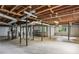 Spacious unfinished basement with exposed ceiling, offering potential for customization at 1215 Vista Leaf Dr, Decatur, GA 30033