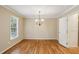 Classic dining room with hardwood floors, chandelier, and natural light at 1215 Vista Leaf Dr, Decatur, GA 30033