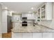 Modern kitchen featuring granite counters, stainless steel appliances, and ample cabinet space at 1215 Vista Leaf Dr, Decatur, GA 30033
