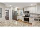 Well-appointed kitchen features granite countertops, stainless steel appliances, and ample cabinet space at 1215 Vista Leaf Dr, Decatur, GA 30033