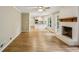 Bright living room with fireplace flowing into a modern kitchen creating an inviting space for entertaining at 1215 Vista Leaf Dr, Decatur, GA 30033