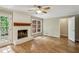 Comfortable living room with fireplace, hardwood floors, and access to the deck via a glass-paneled door at 1215 Vista Leaf Dr, Decatur, GA 30033