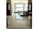 Luxurious bathroom features marble floors, a soaking tub, and glass-enclosed shower at 168 Harmony Grove Rd, Lilburn, GA 30047