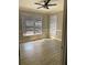 Bright, empty bedroom with wood-style floors and windows at 168 Harmony Grove Rd, Lilburn, GA 30047