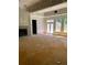 Living room with fireplace, door to the outside, and lots of windows at 168 Harmony Grove Rd, Lilburn, GA 30047