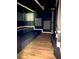 Modern media room with tiered seating, dark walls and sleek lighting at 168 Harmony Grove Rd, Lilburn, GA 30047