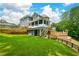 Backyard featuring screened in porch, upper and lower level decks, and retaining wall at 2637 Morningside Nw Trl, Kennesaw, GA 30144