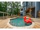 Backyard featuring inground pool with tanning ledge, spa, and outdoor lounge at 2637 Morningside Nw Trl, Kennesaw, GA 30144