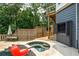 Relaxing backyard featuring a cozy in-ground hot tub, deck and an outdoor TV for entertainment and enjoyment at 2637 Morningside Nw Trl, Kennesaw, GA 30144