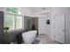 Bathroom features a soaking tub, tiled shower, and arched window at 2637 Morningside Nw Trl, Kennesaw, GA 30144